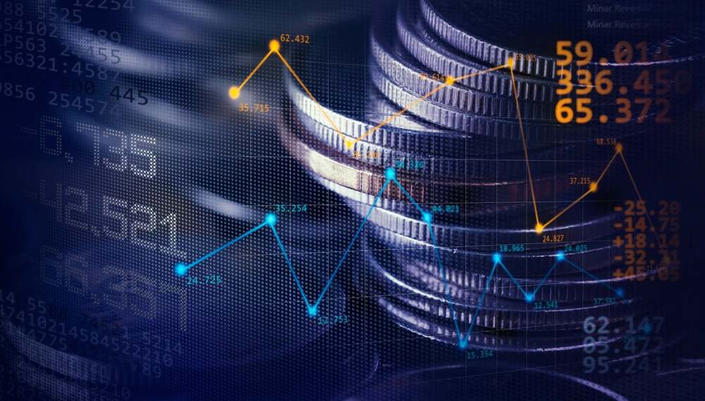 A forex trading concept image showing stacks of coins and price charts.